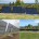 Three solar panels on metal frames in a grassy field with trees in the background.